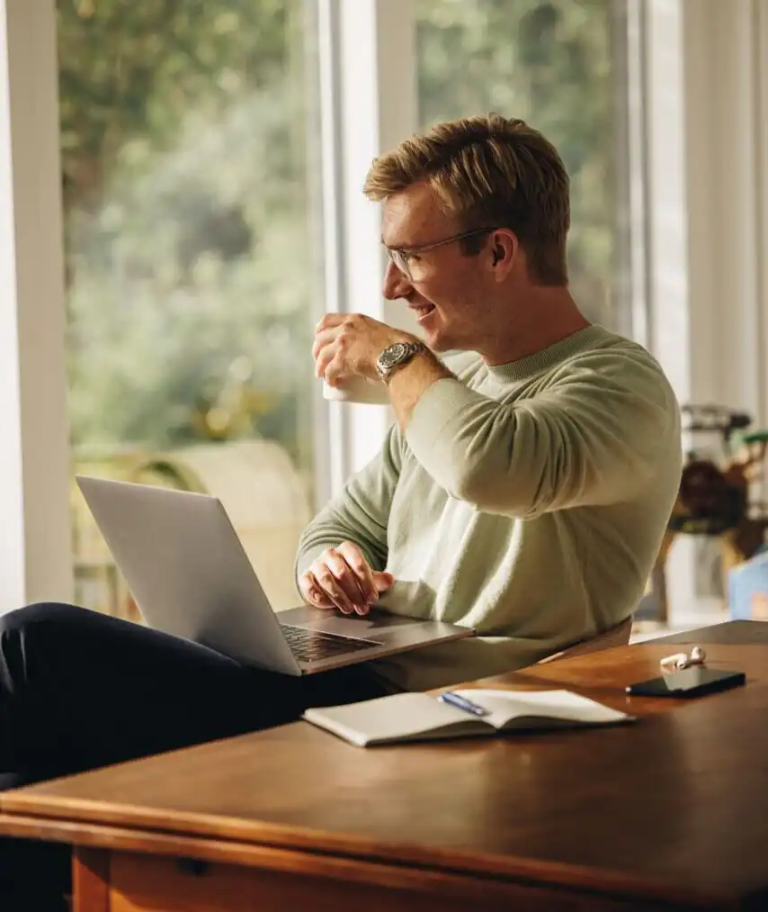 Person starting an LLC online from home on a laptop