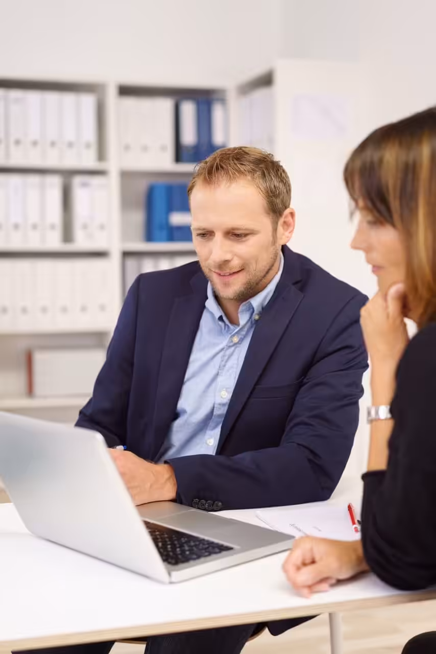 Reviewing final company paperwork on a laptop