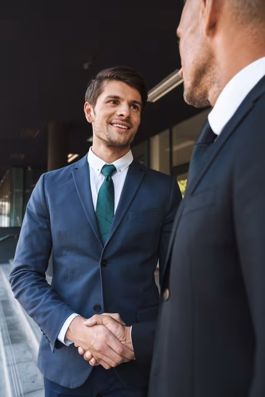 Business partners shaking hands in a professional setting