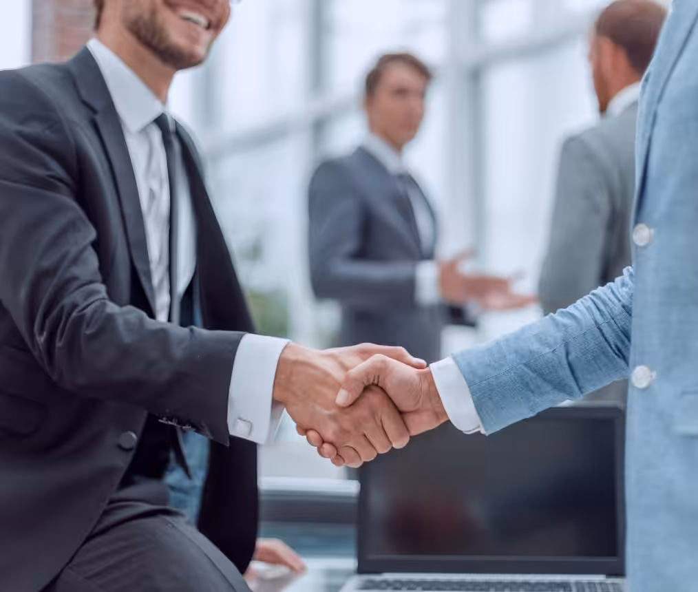 Business partners shaking hands in a professional setting